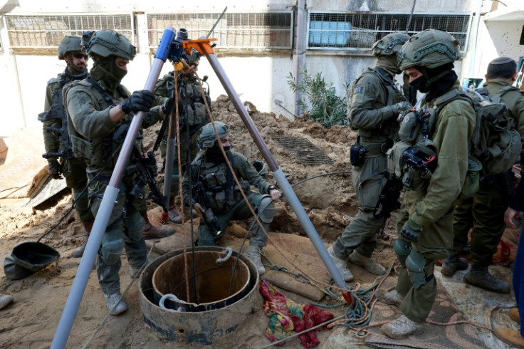 This picture taken during a media tour organised by the Israeli army on February 8 shows Israeli soldiers checking a shaft inside the evacuated Gaza City headquarters compound of the United Nations agency for Palestinian refugees (UNRWA)