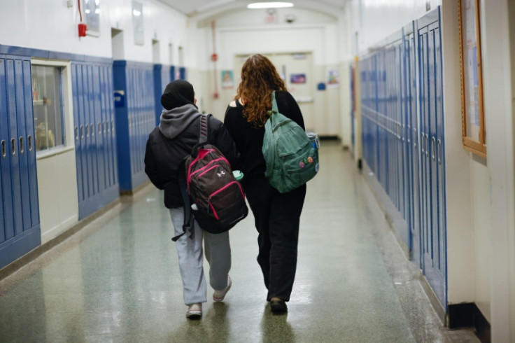 Rawda Elbatrawish (L) and Liora Pelavin are seen in a corridor at Teaneck High School
