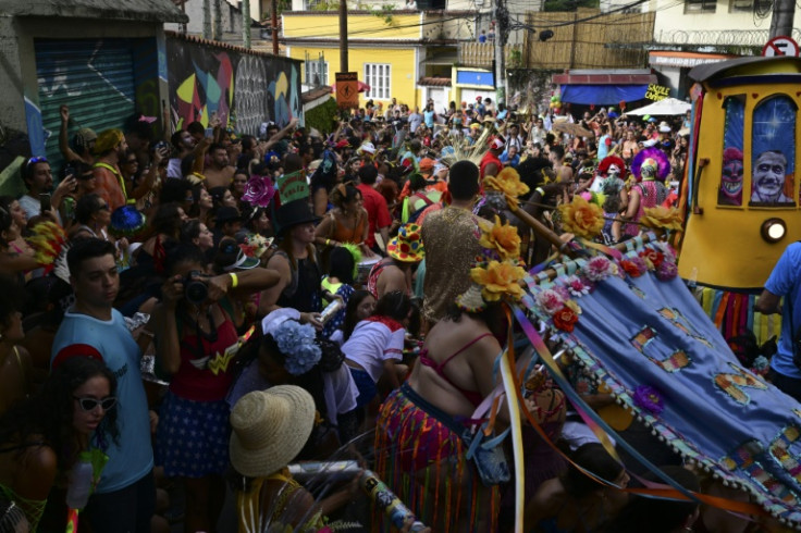 Revellers take part in a 'bloco' group parade in Rio de Janeiro's Santa Teresa neighborhood in Brazil on February 4, 2024