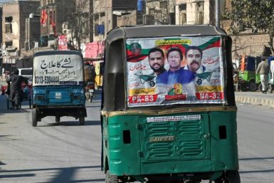 An autorickshaw with a party poster for jailed former prime minister Imran Khan in Peshawar, a day after Pakistan's election