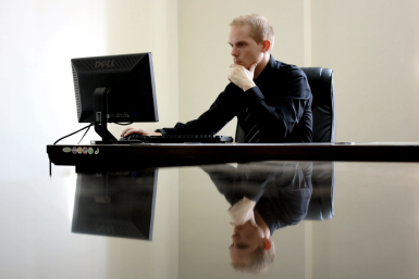 Man typing on a keyboard.