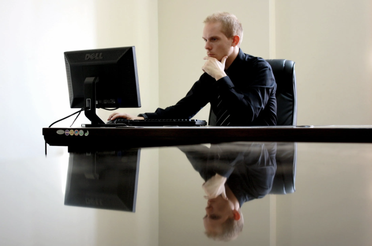 Man typing on a keyboard.