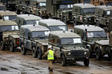 British military vehicles set off for a NATO exercise in Europe