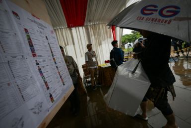 Torrential rain and floods delayed the opening of polling stations in some parts of Jakarta
