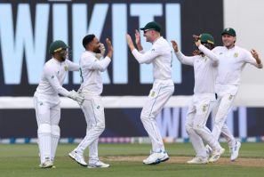 Dane Piedt (second left) and the South Africa players celebrate the wicket of Kane Williamson