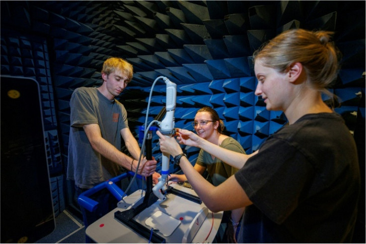 Students from the University of Nebraska work on a small surgical robot called spaceMIRA, before its test on the ISS