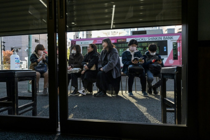 Customers queue outside Tokyo's Onigiri Bongo 90 minutes before the shop opens