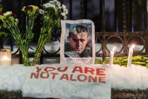 Navalny's supporters left candles, flowers and photos outside the Russian embassy in Oslo