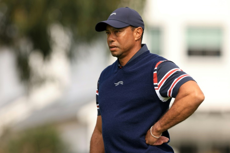 Tiger Woods waits on the first green before withdrawing because of illness from the second round of the Genesis Invitational at The Riviera Country Club