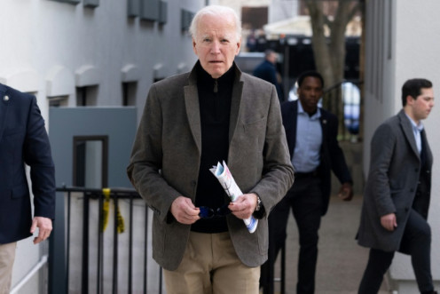 US President Joe Biden approaches the media after leaving St Edmond Roman Catholic Church in Rehoboth Beach, Delaware on February 17, 2024