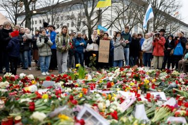 In Germany, people laid flowers and candles at a memorial in front of the Russian embassy in Berlin