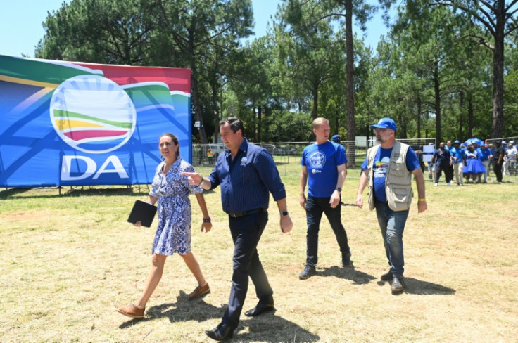 The opposition Democratic Alliance (DA), led by John Steenhuisen (2nd L), senses an opportunity to dent the ANC's grip on power but is seen by some as a party for white voters