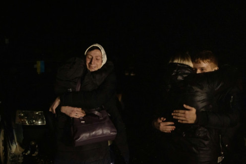 Oleksandr (L), 16, who was kept at a state boarding school in Russian-occupied Lugansk, hugs his aunt Viktoria, 47, after he crossed the border from Belarus to Ukraine