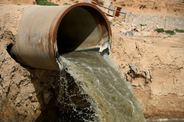 A pipe empties pollutants into the Diyala River east of Baghdad