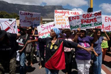 Hundreds of people protest outside the South African parliament as the ANC government unveiled its budget plans