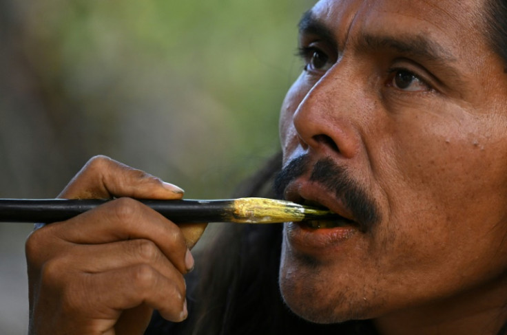 In a form of active meditation, the Arhuaco's 'mamos' spiritual leaders place a wooden stick in their mouths before removing it and rubbing it around a gourd -- transferring their thoughts to the hollowed-out fruit