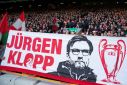 Fans favourite: Liverpool supporters display a banner featuring Liverpool's German manager Jurgen Klopp