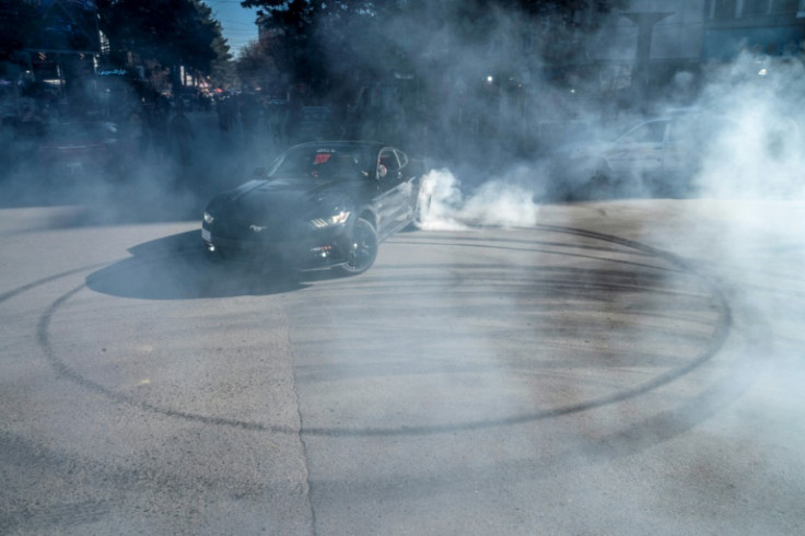 An Afghan motorist drifts whilst he practices for a car racing competition, at the Shahr-e-Naw area in Kabul