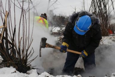 This handout picture provided by Alberta Wildfire shows authorities battling a blaze in Fox Lake that persist despite the cold and snow on February 6, 2024