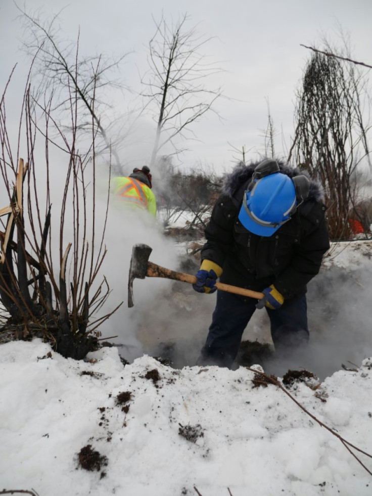 This handout picture provided by Alberta Wildfire shows authorities battling a blaze in Fox Lake that persist despite the cold and snow on February 6, 2024