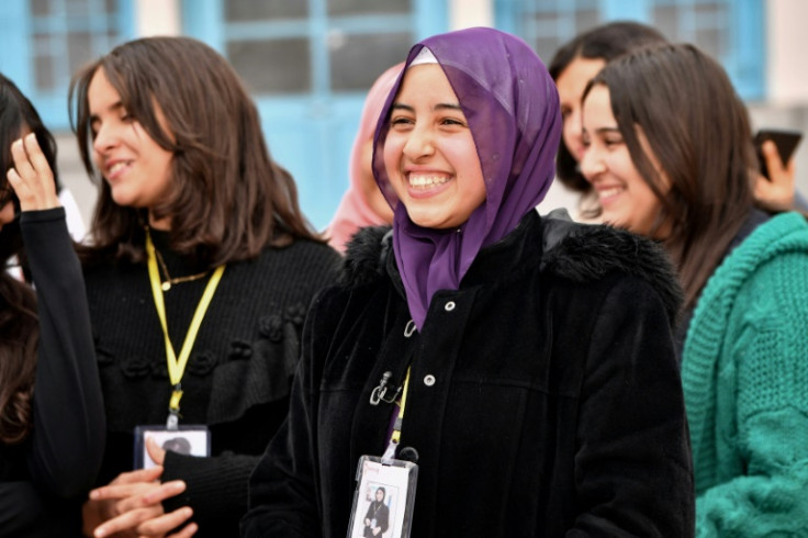 Sixteen-year-old Eya Makhloufi, in the centre, with music club members