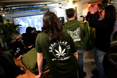 Staff members at the Hemp Museum in Berlin on Friday watching the parliament vote to legalise cannabis