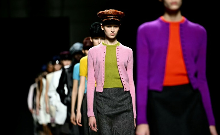 Feminine twinsets in contrasting colors were featured at Prada