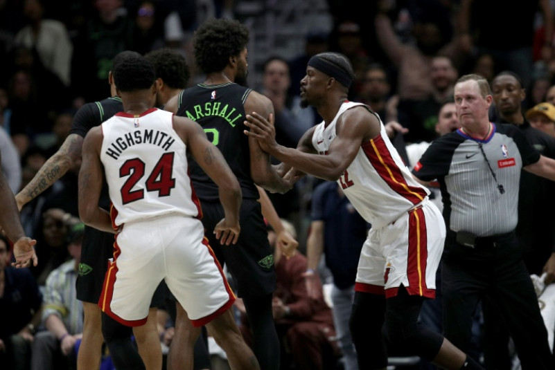Miami's Jimmy Butler, right, pushes Naji Marshall of the New Orleans Pelicans during an altercation that led the NBA to suspended each for one game