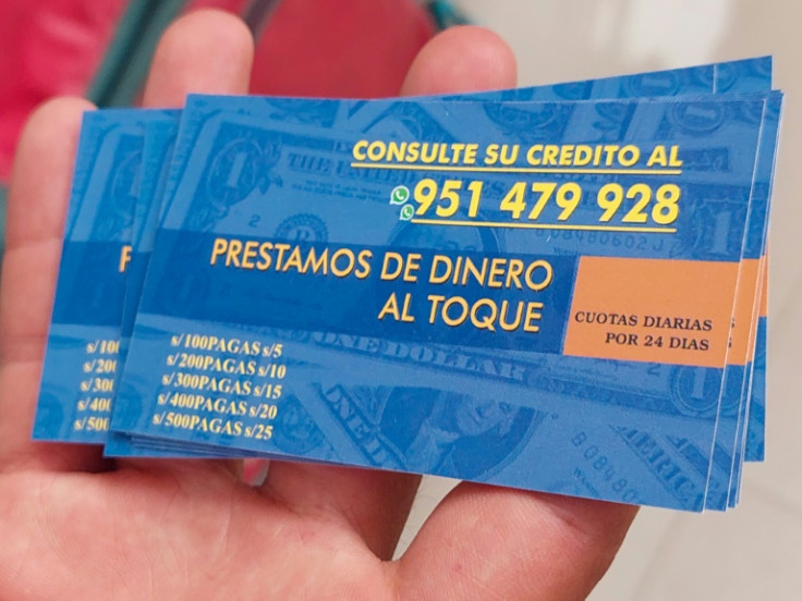 Cards promoting easy-to-obtain loans -- a popular way Peruvian racketeers extort victims