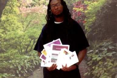C. Miles (inmate) holding SawariMedia newsletters