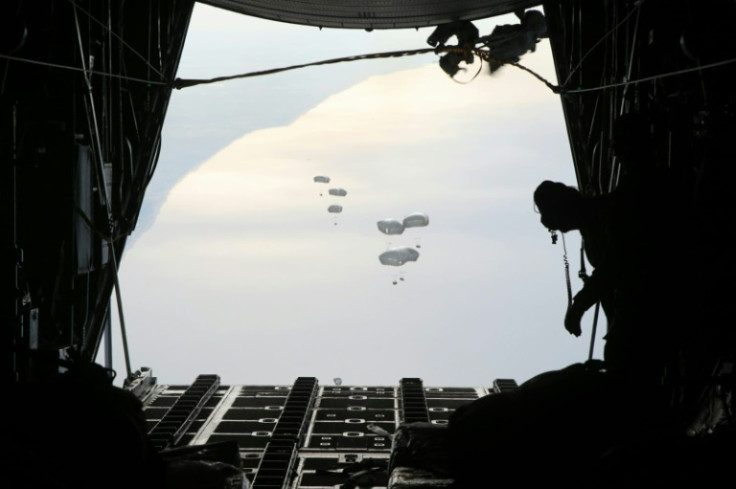 A Jordanian military aircraft drops humanitarian aid over Rafah