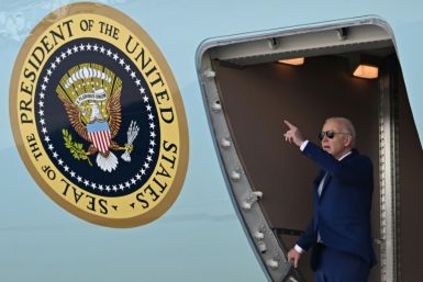 US President Joe Biden gestures as he arrives at John F. Kennedy International Airport, in Queens, New York on February 26, 2024