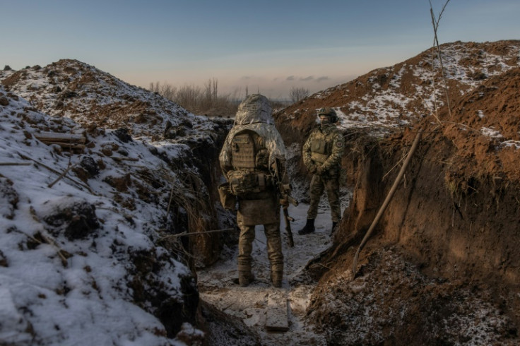 Ukrainian soldiers in a trench near the front line in Kharkiv region in January 2024