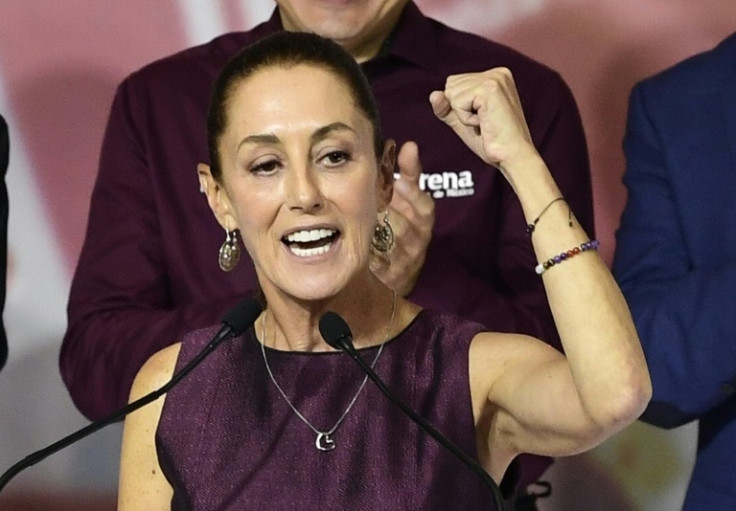 Former Mexico City mayor Claudia Sheinbaum celebrates after being named presidential candidate of the ruling Morena party