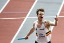 Belgium's Alexander Doom crosses the finish line of the world indoor 4x400m relay