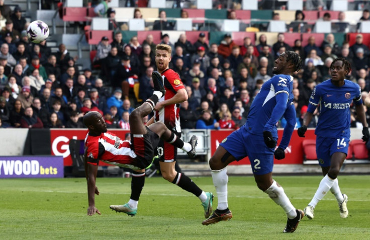Brentford forward Yoane Wissa (L) attempts an overhead kick against Chelsea.