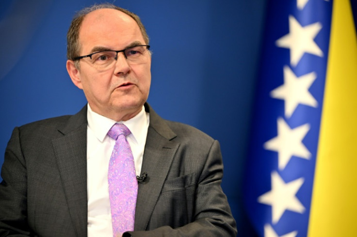 Warning: Bosnia envoy Christian Schmidt poses