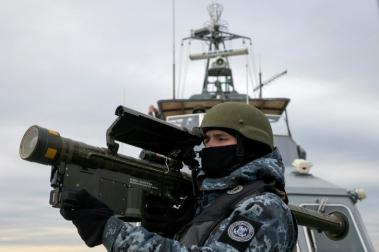 A Ukrainian serviceman with an anti-aircraft weapon scans the Black Sea