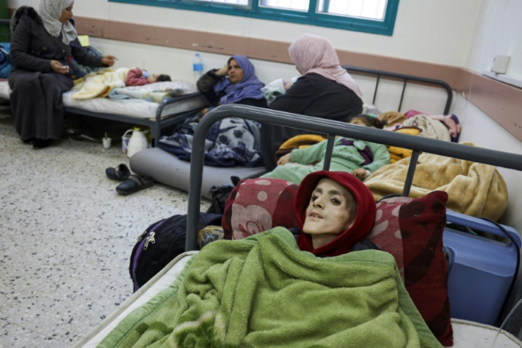 Ten-year-old Palestinian boy, Yazan al-Kafarneh, displaced from Beit Hanun and suffering from a pre-existing condition, lies on a hospital bed at Al-Awda clinic in Rafah; he died on March 4 severe malnourishment and insufficient healthcare