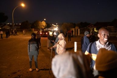 Lourierpark residents set up a barricade overnight to protect their neighbourhood from what they see as the threat of squatters setting up shacks on invaded land opposite the community