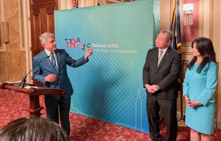 Representative Mike McCaul (L), the chairman of the House Foreign Affairs Committee, addresses an event alongside Taiwan’s representative in Washington, Alexander Tah-Ray Yui (C), and Yui’s wife Karen Lo at the US Capitol marking the 45th anniversary of t
