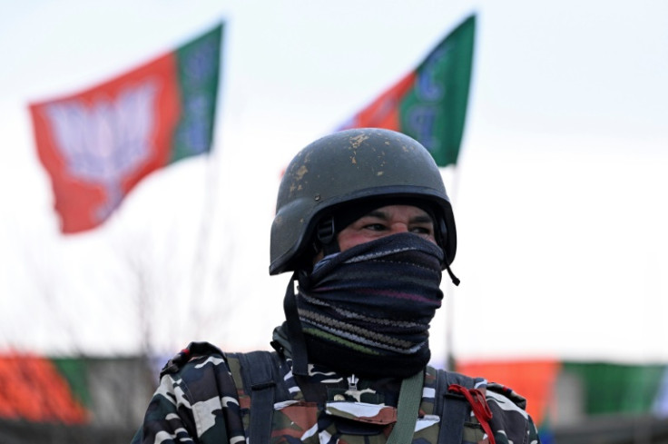 An Indian security officer stands guard outside the venue where India's Prime Minister Narendra Modi is due to hold a rally in Srinagar