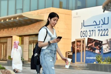 The youngest of the three Otaibi sisters, Manahel, now 29, is photographed walking through the streets of Riyadh in Western dress before her arrest in 2022 for challenging the kingdom's dress code for women