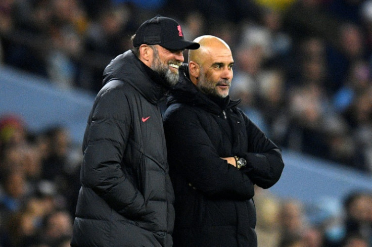 Liverpool manager Jurgen Klopp (L) and Manchester City boss Pep Guardiola