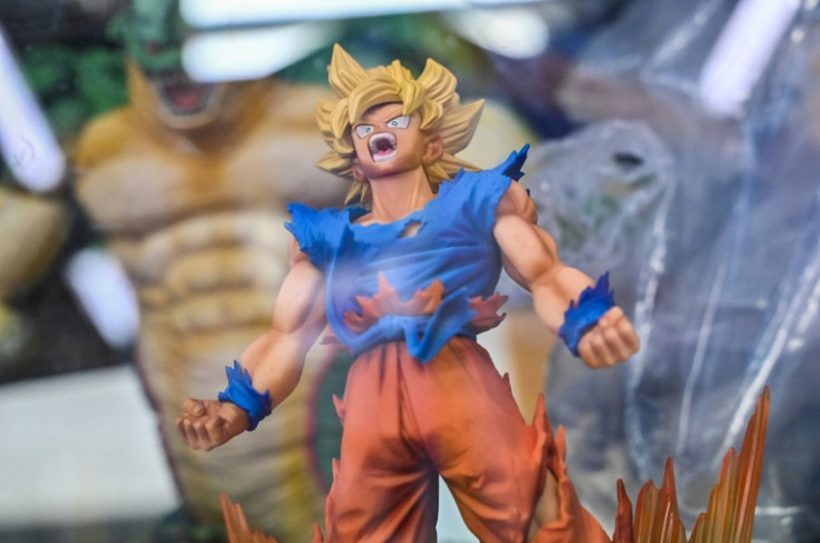A figurine character from the popular "Dragon Ball" manga franchise sits for sale inside a glass case at a shop in downtown Tokyo
