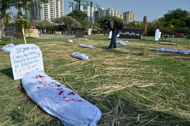 Paint-spattered bodybags represent the toll of violence against women in Karachi, Pakistan