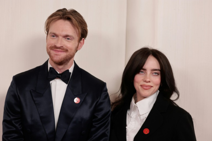 Billie Eilish (R) and her brother Finneas O'Connell -- Oscar nominees for best original song from the 'Barbie' soundtrack -- wore Artists4Ceasefire pins, drawing attention to the conflict in Gaza