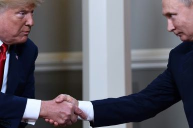 US President Donald Trump and Russian President Vladimir Putin shake hands in Helsinki, on July 16, 2018