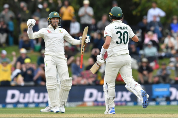 Alex Carey (L) and Pat Cummins celebrate Australia's second Test victory over New Zealand on Monday in Christchurch