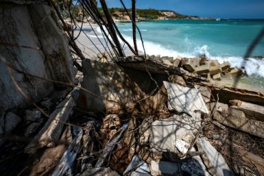 View of a grave destroyed due to sea level rise at the Tierra Bomba island cemetery in Cartagena, Colombia